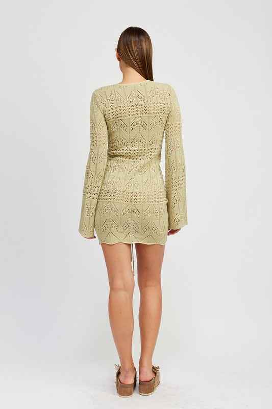 Back view of Emory Park ruched crochet mini dress in a light green color with bell sleeves