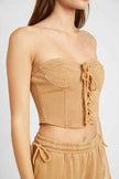 Emory Park French terry strapless bustier top in beige, featuring a lace-up front and form-fitting design
