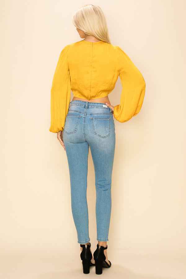 Long sleeve crop top with an open front design