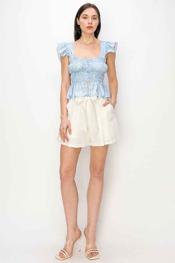Flounced cap sleeves and hem floral print top