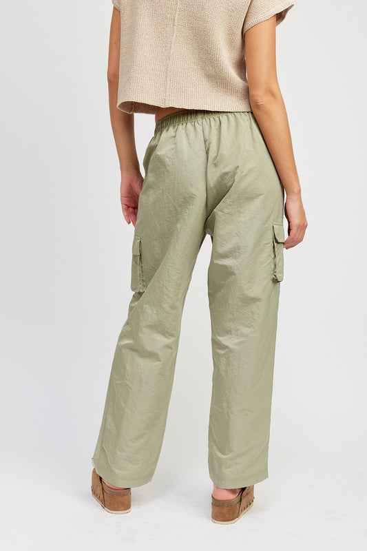 Emory Park stylish straight leg pants with elastic waistband in light green, featuring a relaxed fit and cargo pockets