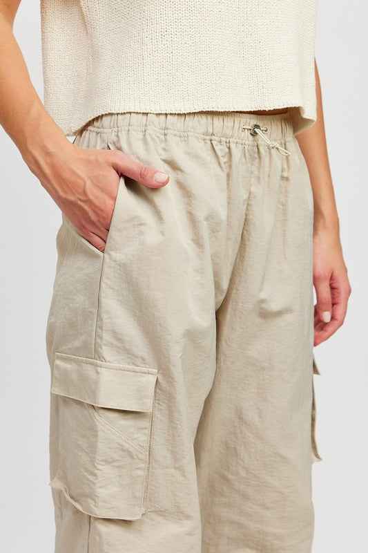 Emory Park beige straight leg pants with elastic waistband and side pockets for comfortable wear