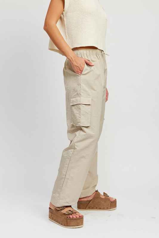 Emory Park beige straight leg pants with elastic waistband, featuring side pockets and a relaxed fit