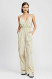 Emory Park women's cargo jumpsuit in light beige with a halter neck design and practical side pockets