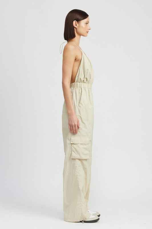 Women's cargo jumpsuit by Emory Park in beige with a stylish halter neck and side pockets