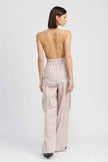 Back view of a women's cargo jumpsuit by Emory Park featuring a stylish halter neck and relaxed fit