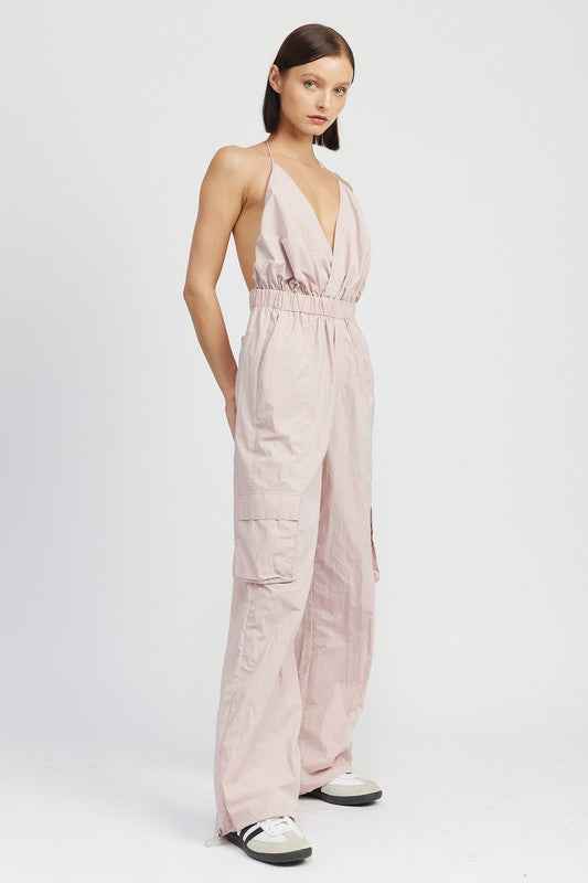 Emory Park women's cargo jumpsuit in soft pink with a halter neck design and relaxed fit
