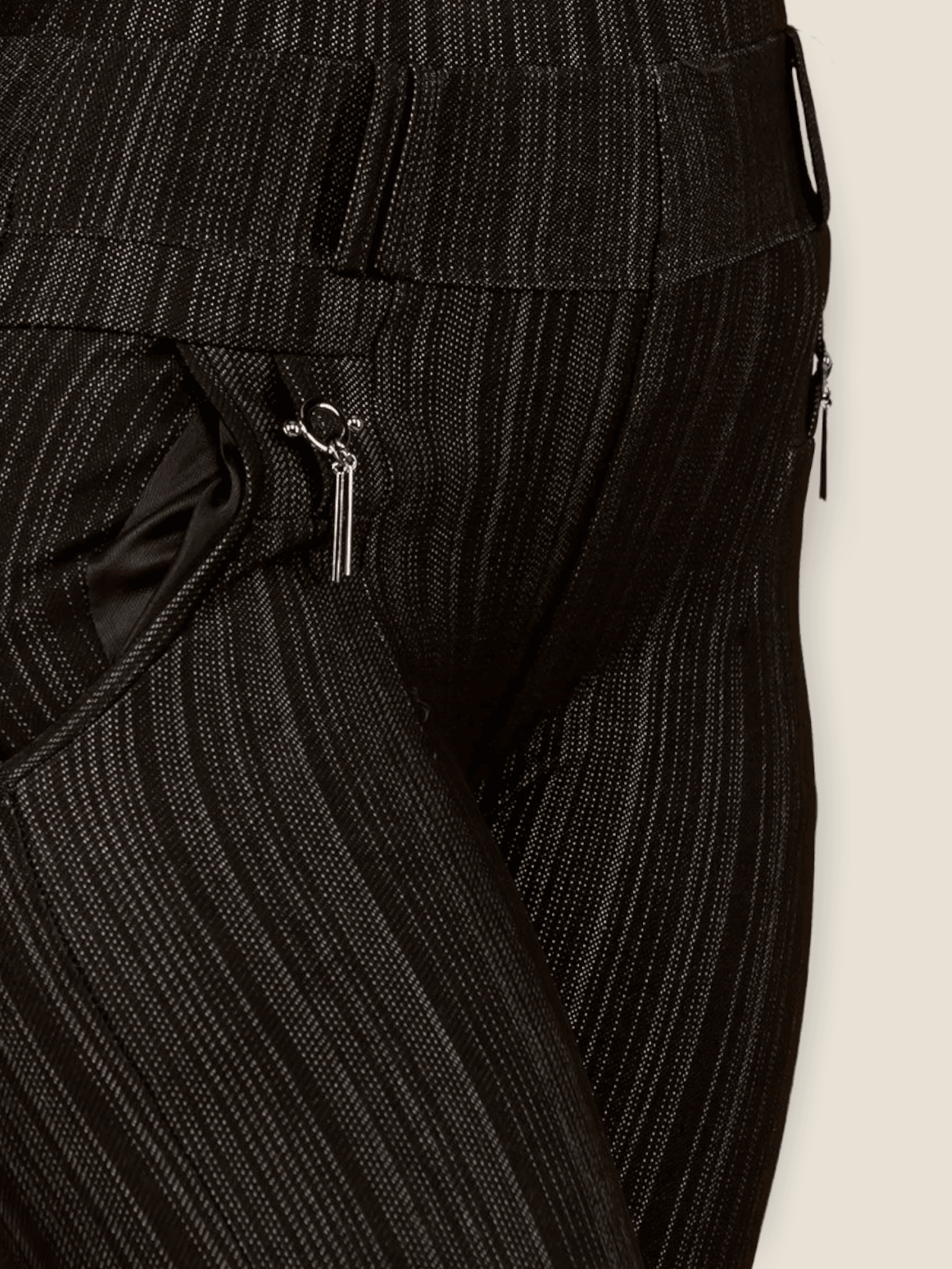 Close-up of black striped jeggings for women with stylish side pockets and a comfortable fit