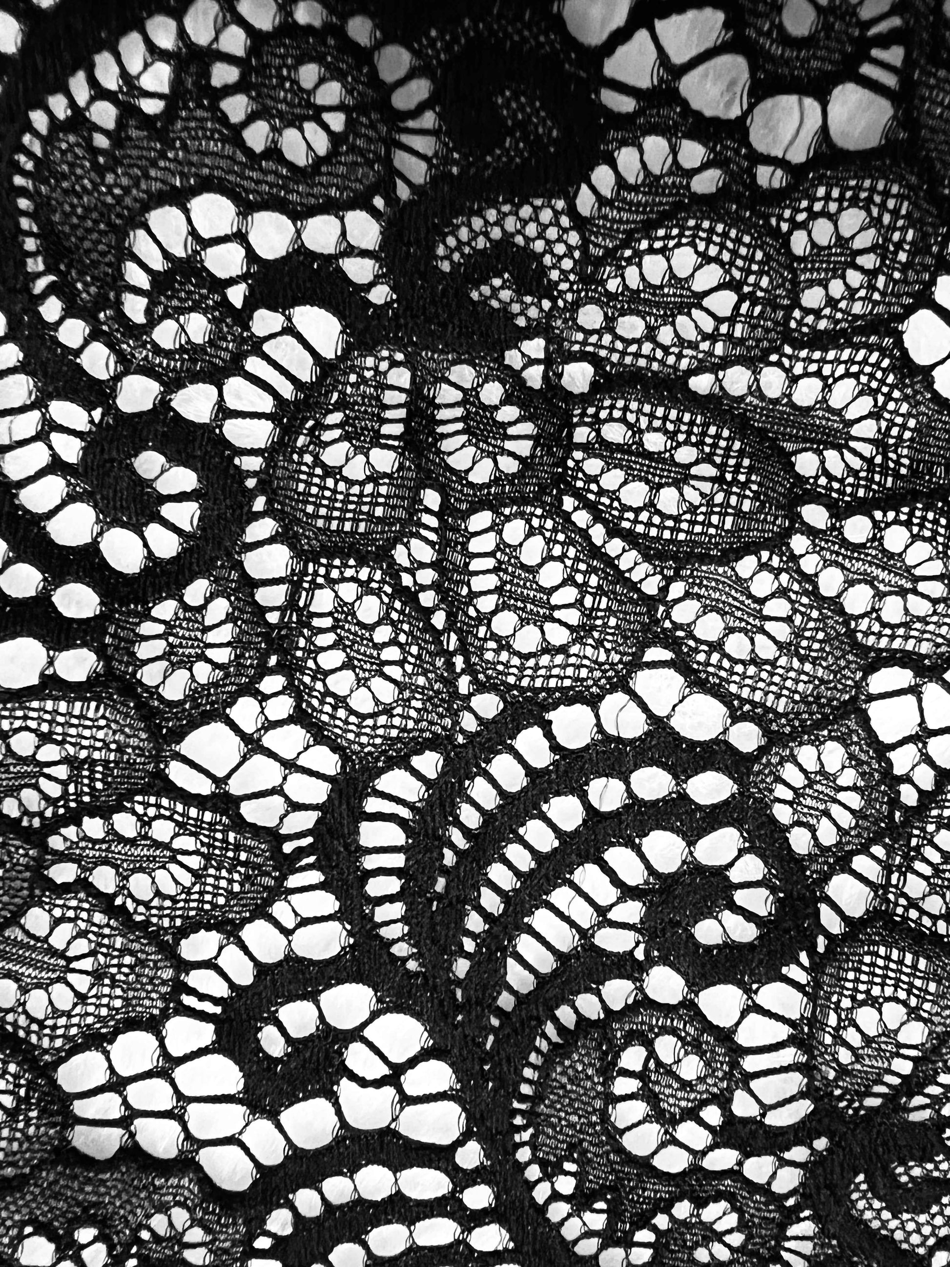 Close-up of intricate black lace fabric for a plus size lace bodysuit by Pikemla