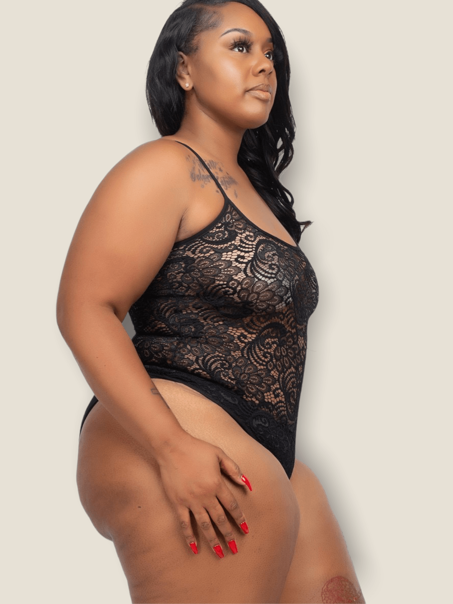 Plus size lace bodysuit by Pikemla featuring a stylish floral design and adjustable straps