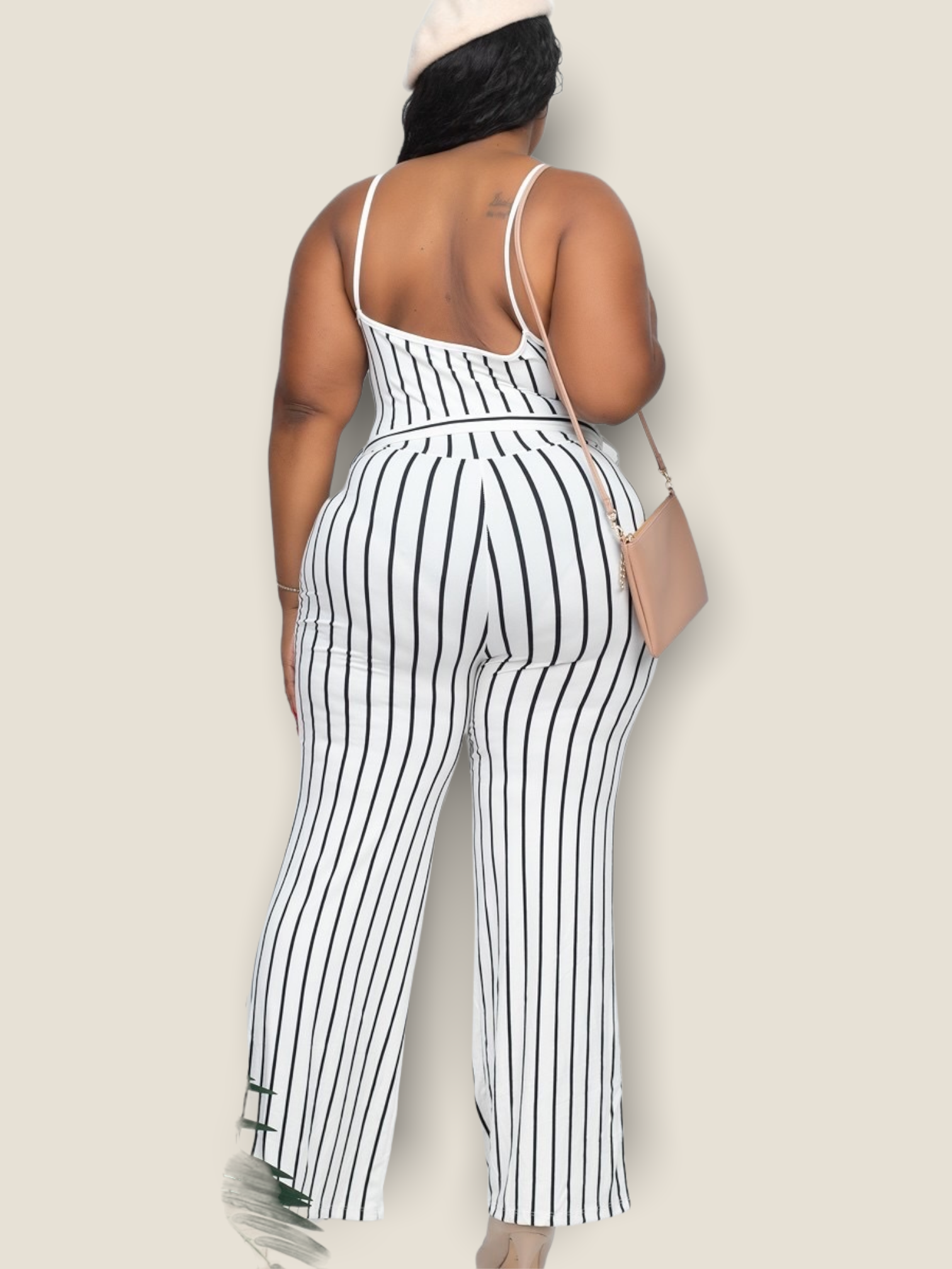 Plus size white striped jumpsuit with a trendy back and stylish wide-leg design