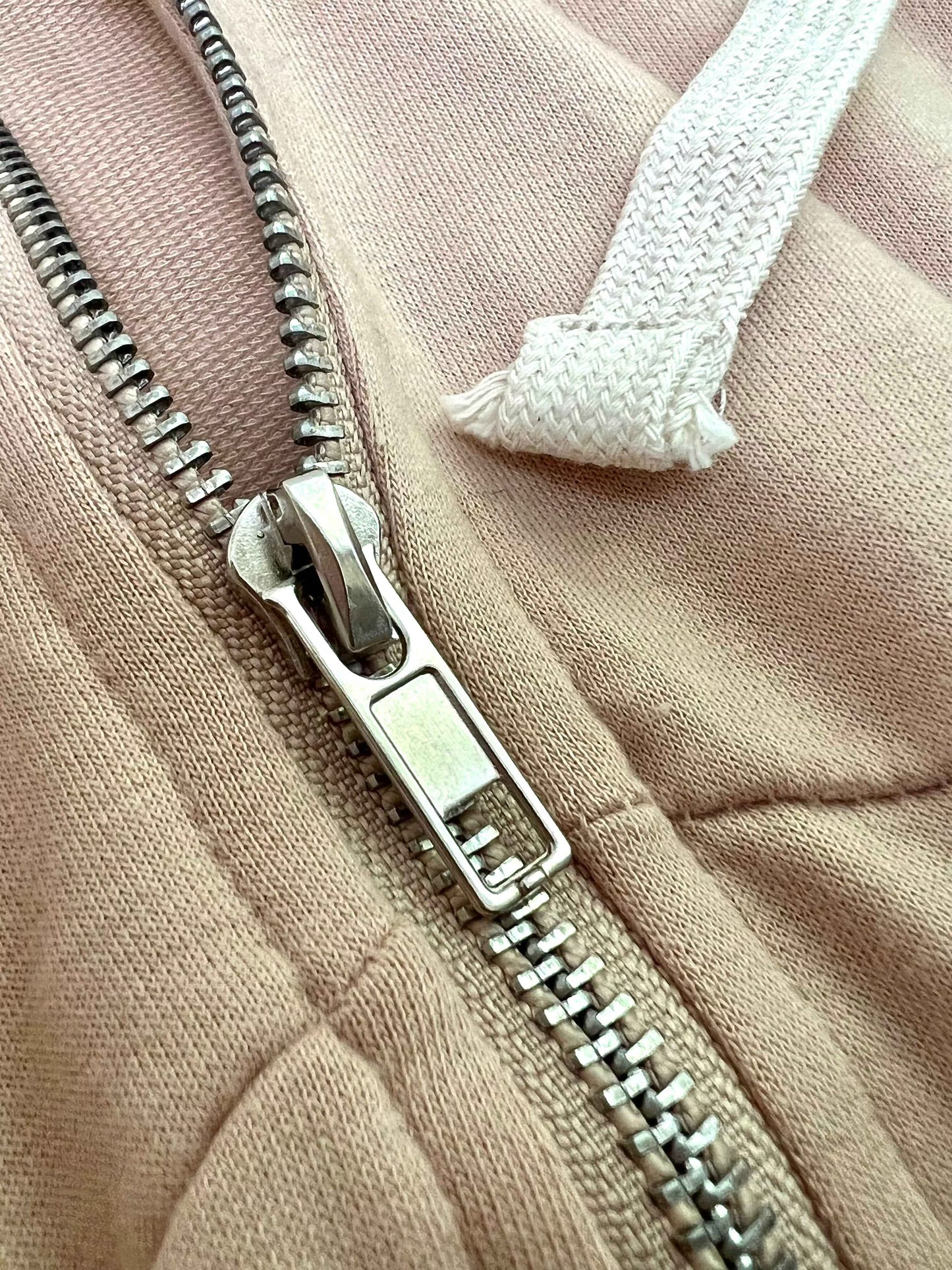 Close-up of zipper detail on women's oatmeal jogger set by Pikemla for stylish comfort
